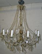 8 branch gilt metal chandelier with scro