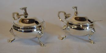 Pair of silver mustard pots with liners,