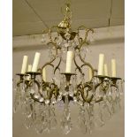 Gilt metal chandelier with 10 scrolled b