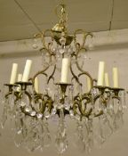 Gilt metal chandelier with 10 scrolled b