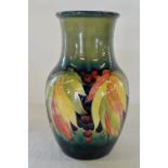 Large Moorcroft 'leaf and berries' vase with blue W Moorcroft signature and 'Potter to H M the