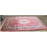 Red ground Kashmir carpet with a traditi