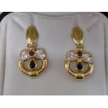 Pair of 18ct gold earring with ruby or s