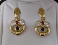 Pair of 18ct gold earring with ruby or s