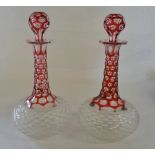 Pair of cranberry cut glass decanters