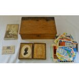 Wooden box containing old luggage sticke