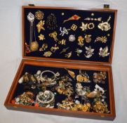 Box of costume jewellery including brooc