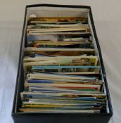 Box containing foreign postcards