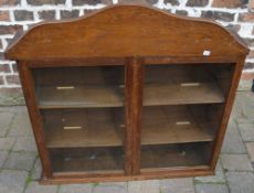 Oak glass front cabinet with sliding doo