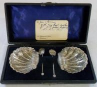 Cased set of silver shell salt dishes wi