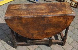 Georgian oak gate leg table with some re