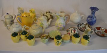 Various ceramics including teapots, wall