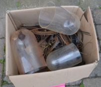 Box of clock parts including glass domes