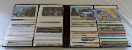 Brown postcard album containing various