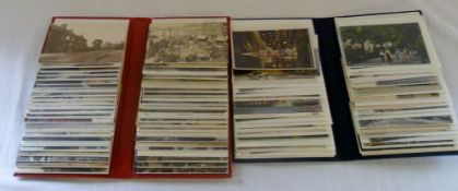 Blue and red postcard albums containing