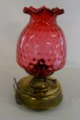 Late Victorian oil lamp with cranberry g