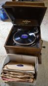 Wind up gramophone with a box of records