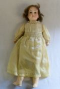 Bisque head doll with jointed limbs