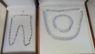 Rodium plated blue and white stones neck