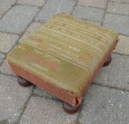 Victorian footstool covered with a sampl