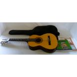 Half size acoustic guitar, case and musi