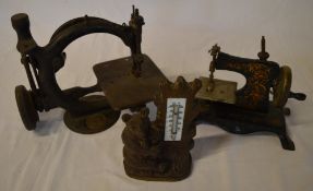 2 miniature sewing machines and a Black