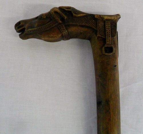 Walking stick with carved horse head handle