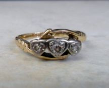 18ct gold ring with 3 diamonds in heart