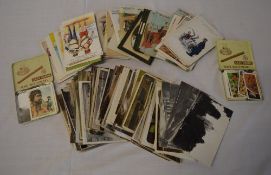 Various postcards and two small tins of