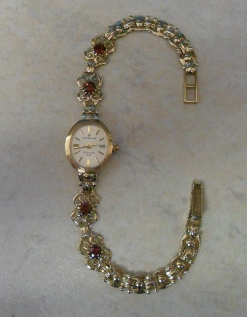 9ct gold ladies watch with garnet stones