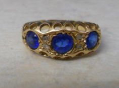 22ct gold dress ring with blue glass sto