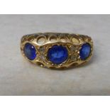 22ct gold dress ring with blue glass sto