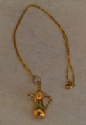18ct gold pendant in the form of a jug,