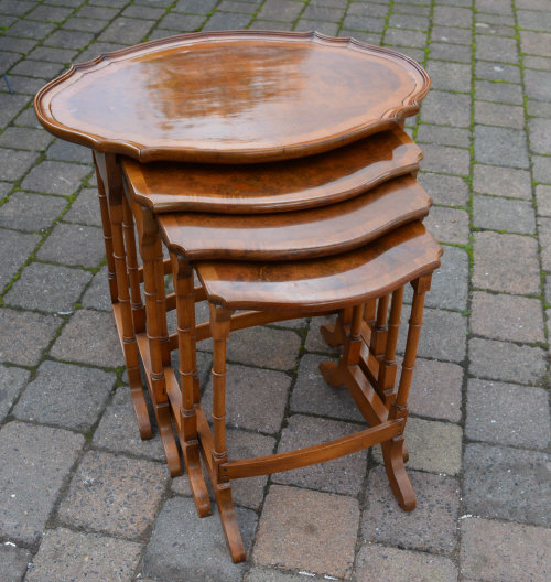 Nest of 4 walnut veneered tables