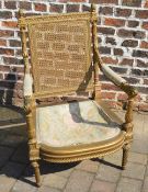 Gilt cane back open armchair