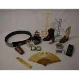 Various boots, silk fan, zebra skin belt