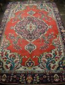 Large red ground multi colour medallion