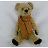 Vintage teddy bear with knitted scarf 35