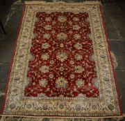 Red ground Kashmir rug with ziegler desi