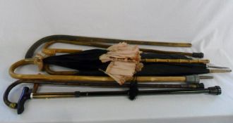 Selection of walking sticks and umbrella