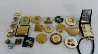 Assorted compact cases and pill boxes in