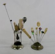 Silver hat pin stand with assorted hat p