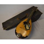 A mandolin decorated with the figure of
