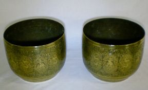 Pair of ornately engraved brass Asian ja