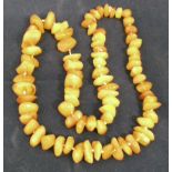 String of 77 irregular form amber beads