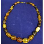 String of 29 natural form amber beads 80