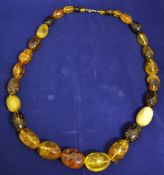 String of 29 natural form amber beads 80