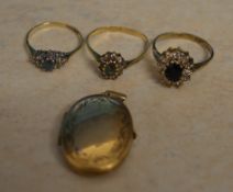 3 gold rings and a gold locket