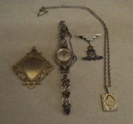 Silver brooch, pendant, locket in the fo