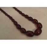 Cherry amber graduated bead necklace wit